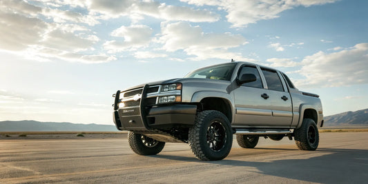 A Chevy truck with a heavy-duty custom front bumper.