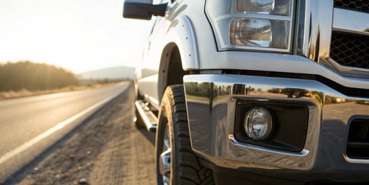 Close-up of a durable chrome rear bumper on a pickup truck.