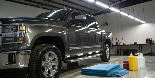A truck being professionally detailed in preparation for consignment.