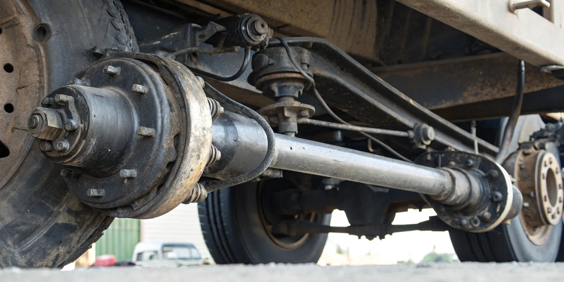 Close-up of a bad drag link on a semi truck showing symptoms of wear.