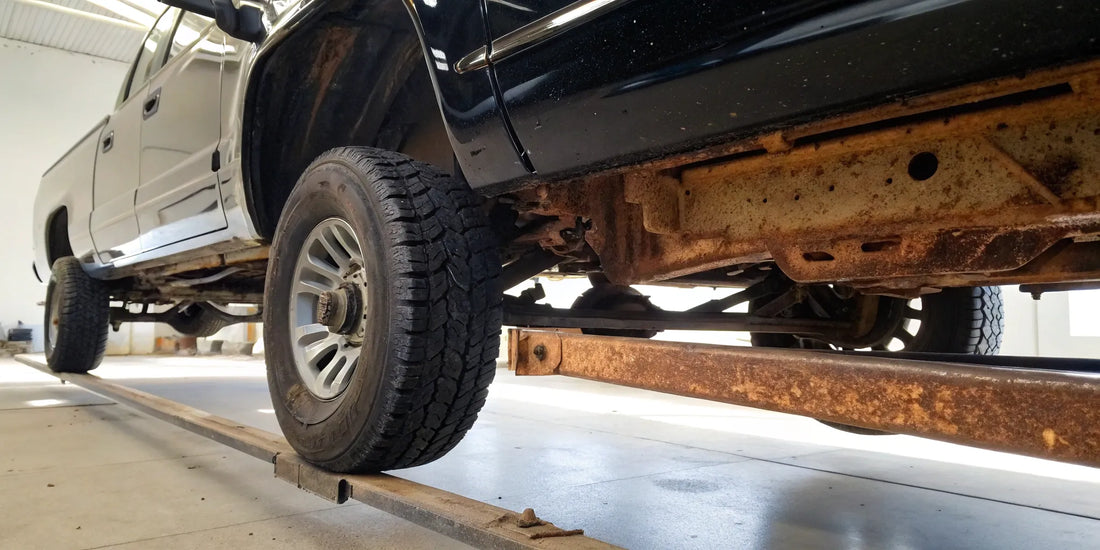 A rusty truck frame ready for a new coat of paint over the rust.