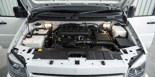 An open diesel truck engine bay prepared for routine service.