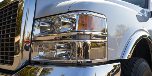 A Freightliner with quality aftermarket headlight and chrome parts.